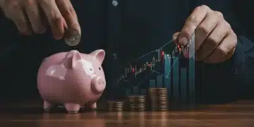 Hand placing coins into piggy bank with inflation graph in background